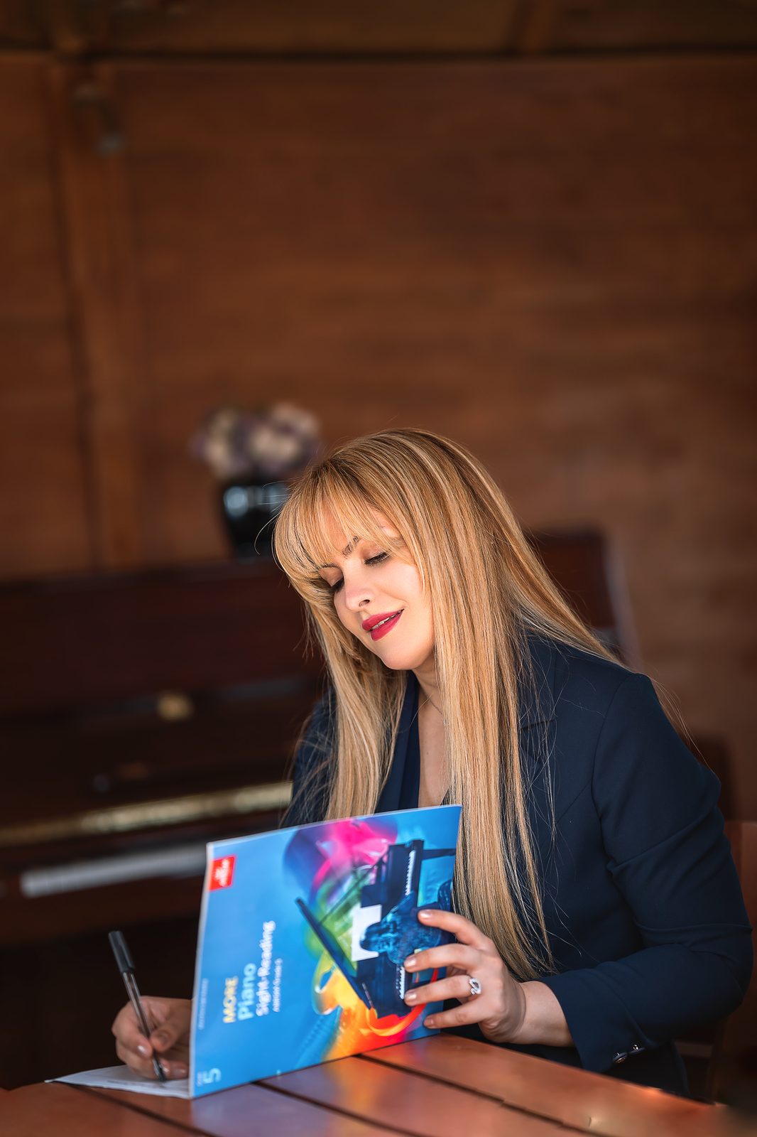 Siranoush holding the sight-reading workbook
